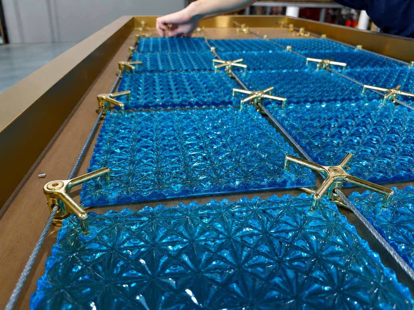 Close view of blue crystal modules, support cables and gold connectors