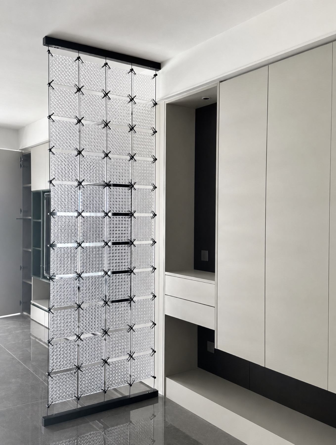 Completed clear crystal panel divider installed between built-in interior cabinetry