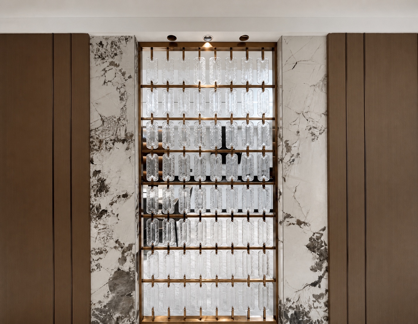 Clear linked rectangular crystal elements installed in a bronze frame